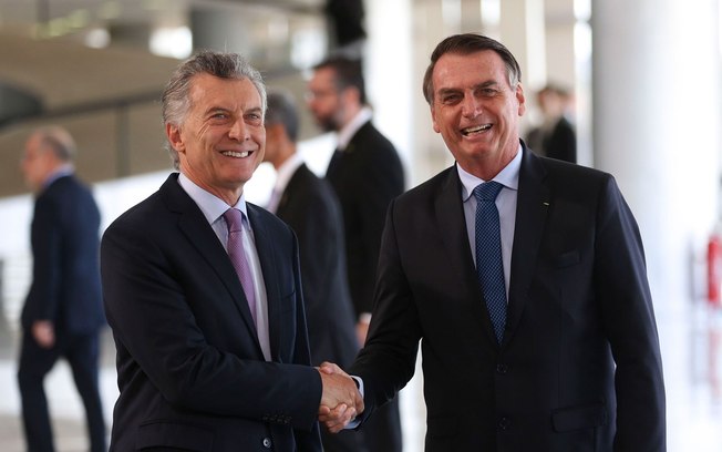 ‘Queremos que aquela velha esquerda não volte ao poder’, diz Bolsonaro ao pedir apoio a empresários brasileiros para reeleição de Macri