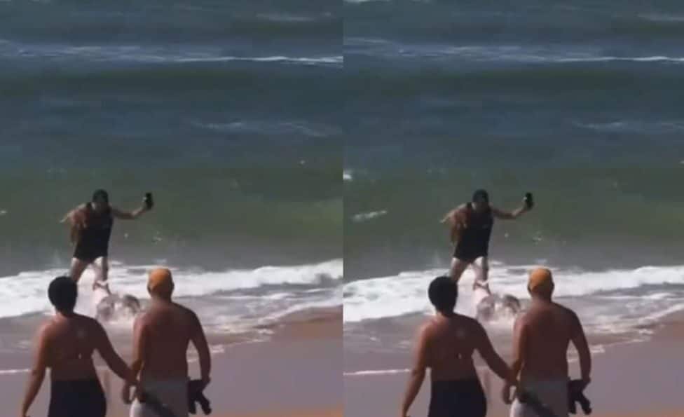 Homem salva cachorro de ser atacado por pitbull na praia de Jauá